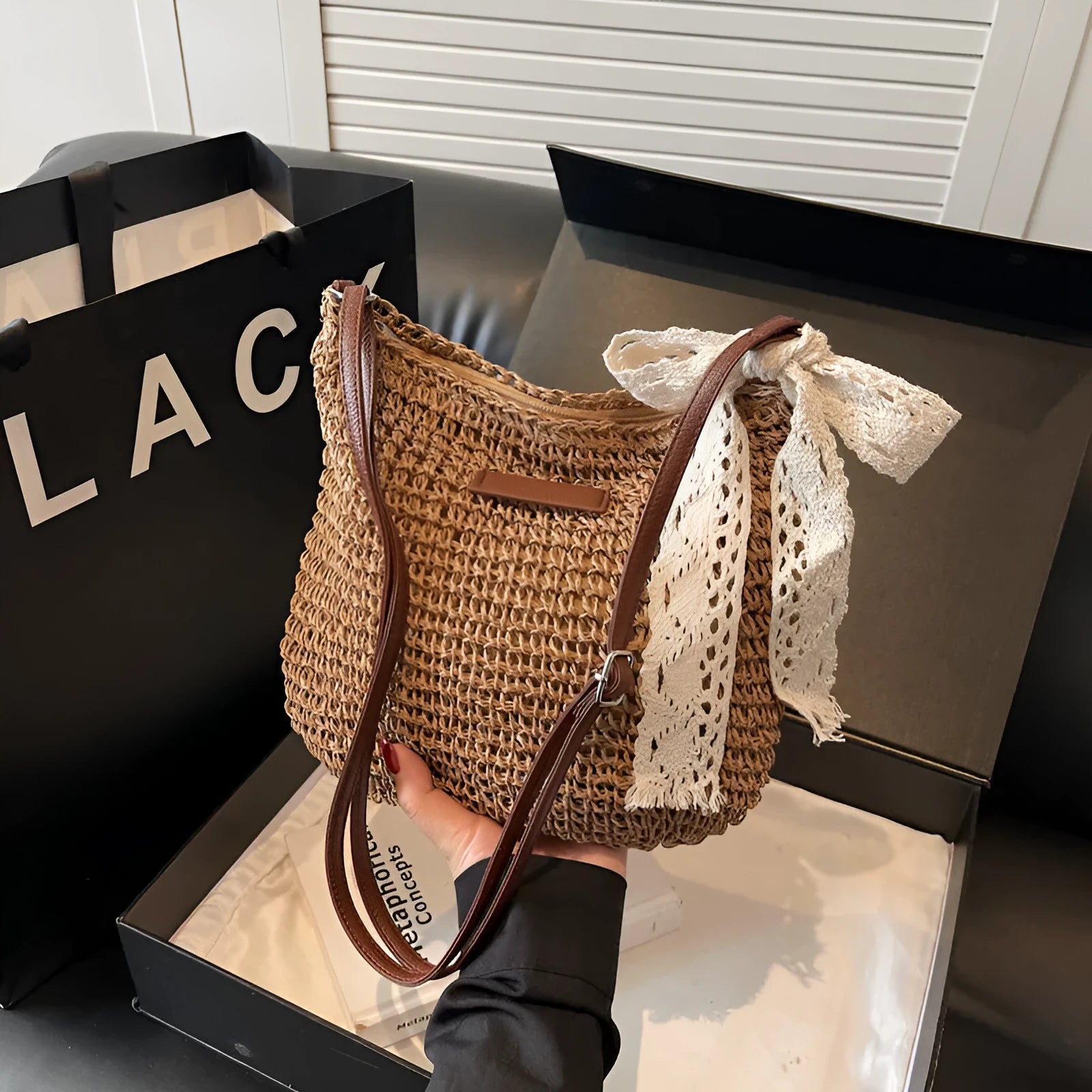 Women's woven straw messenger bag with hollowed design in khaki colour