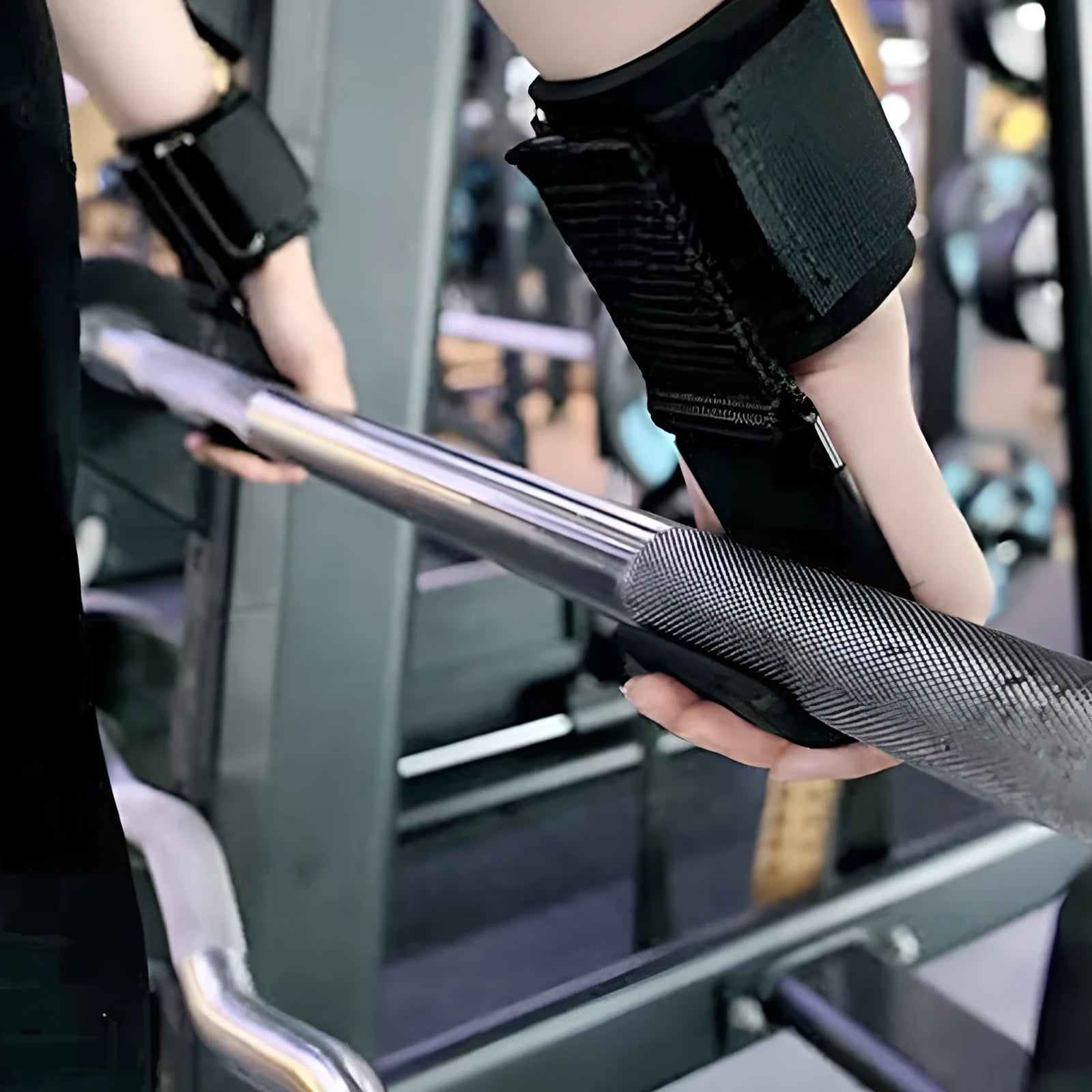 Black fitness wrist brace pair with metal hook for pull-up bar attachment