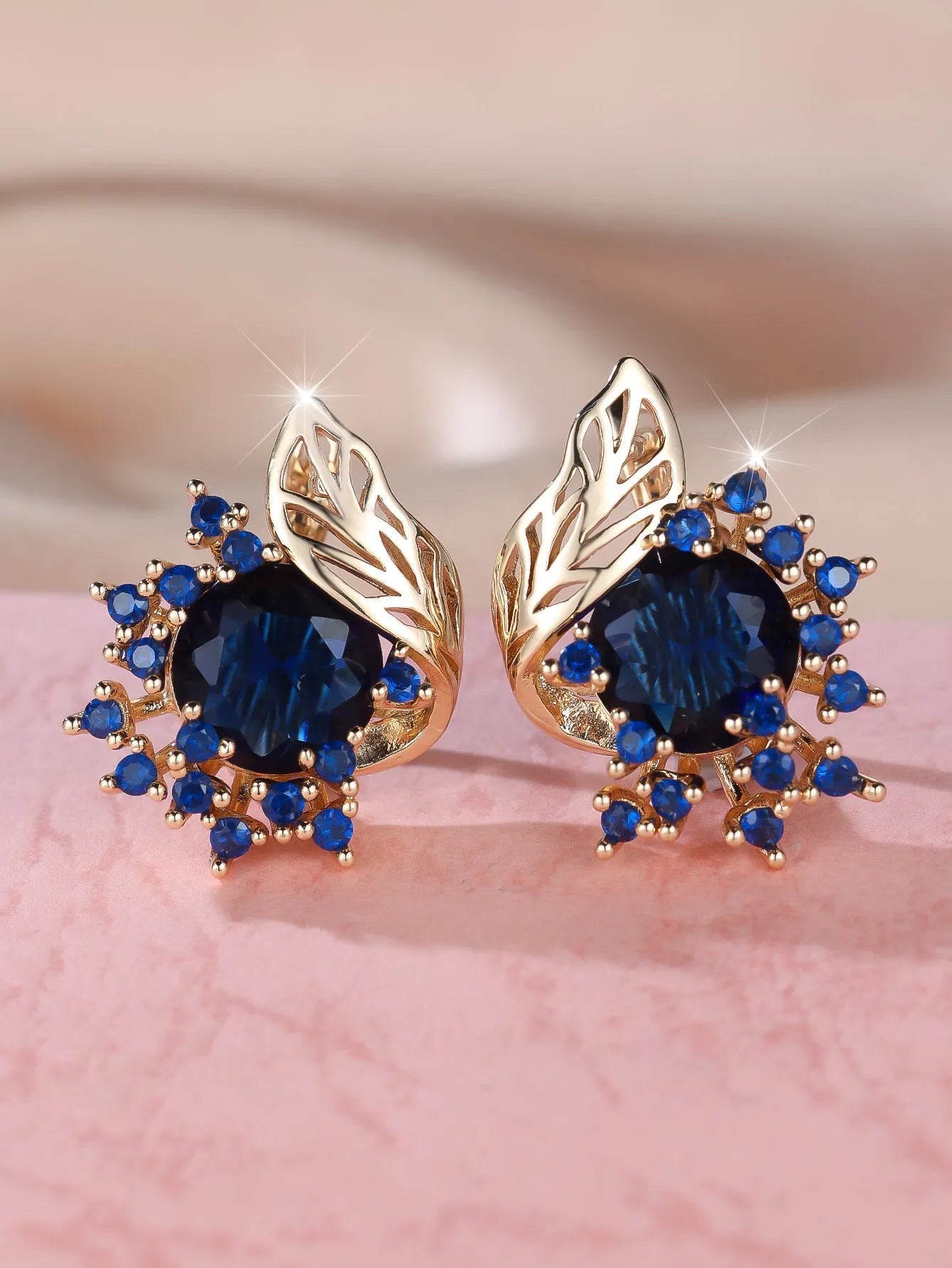 Round flower feather earrings with zircon stones in champagne gold finish, approximately 2-3cm diameter