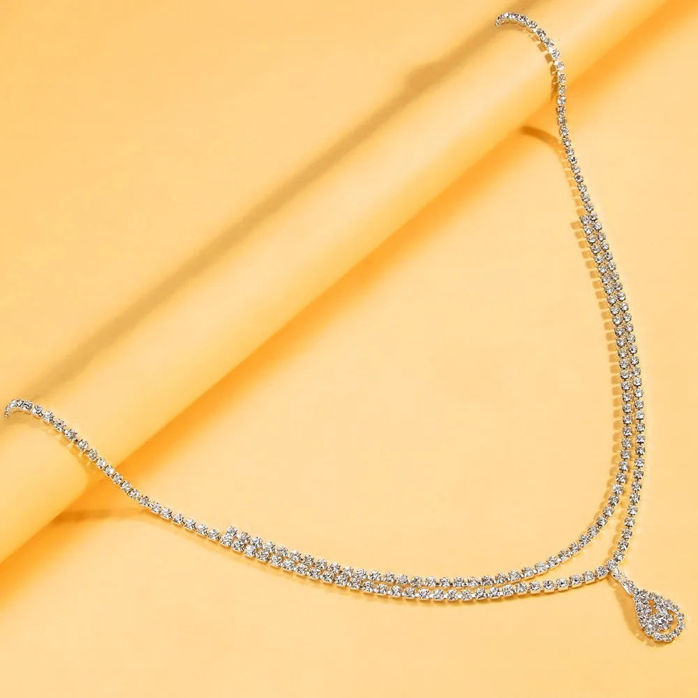 Gold or silver rhinestone waist chain with water drop pendant and lobster clasp closure
