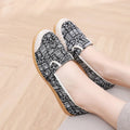 Women's ethnic style flat heel cloth shoes with colour stitching and shallow mouth design.