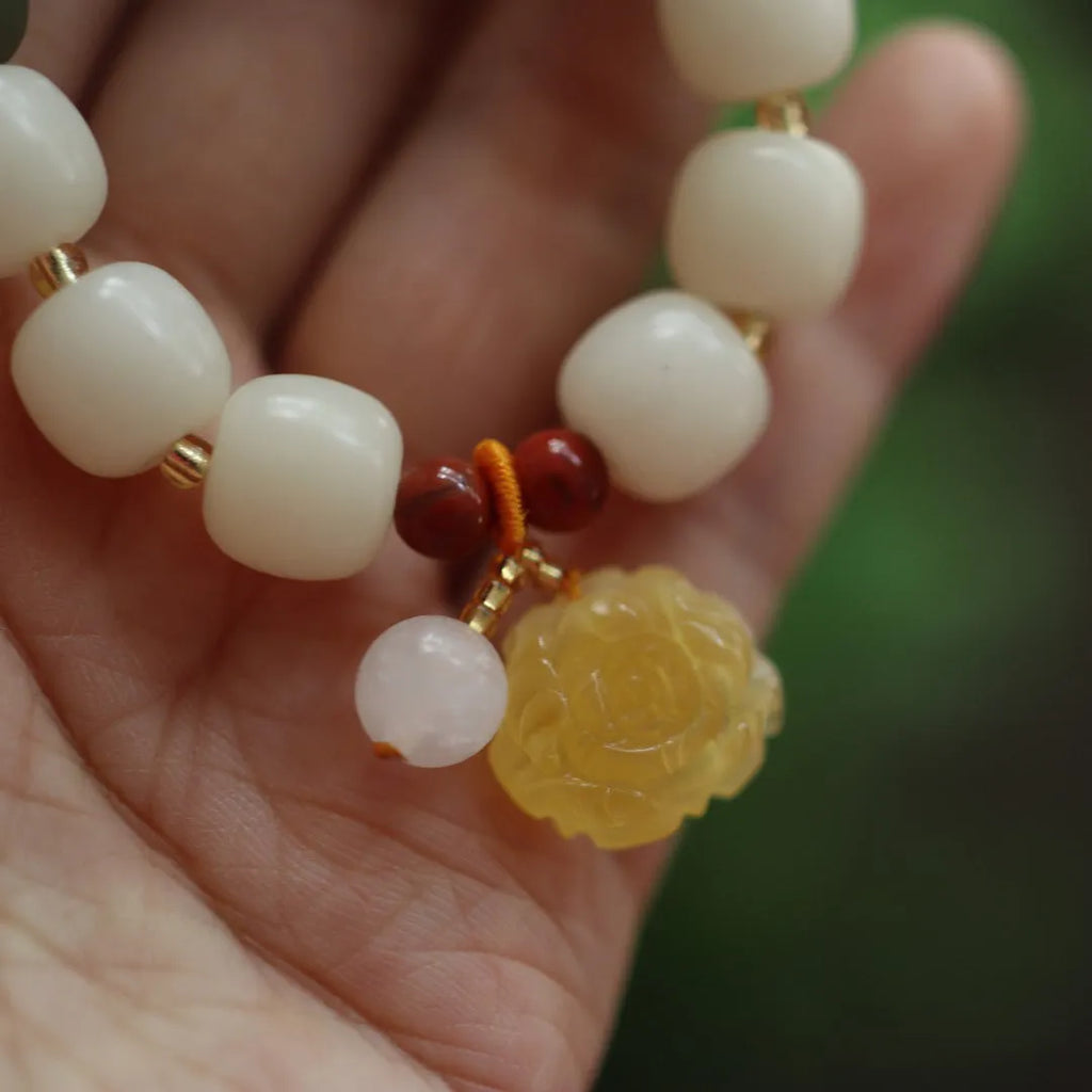 Woven Bodhi root bracelet with gradient white jade colour and natural beeswax Lotus elements, 10mm floral retro design.