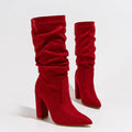 Women's black suede chunky heel pointed toe boots with a mid-calf length.
