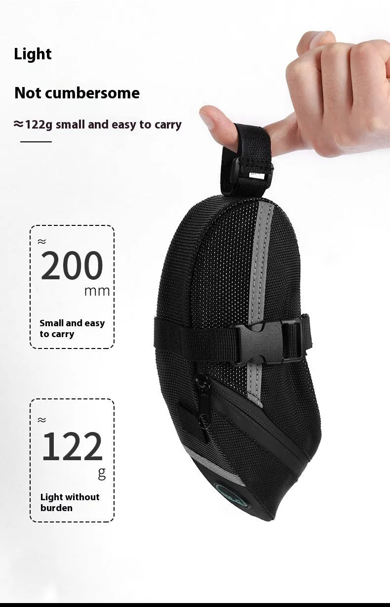 Black cycling tail bag mounted on mountain bike saddle with quick release fixture