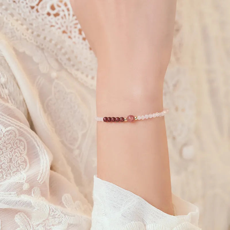 Handmade pink crystal bracelet with strawberry quartz beads and animal zodiac design