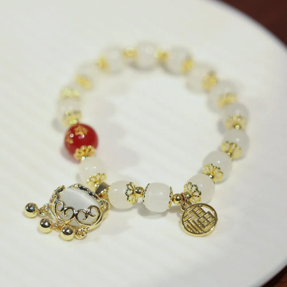 Chinese style women's coloured glaze bracelet with safety lock, windmill and bamboo charms