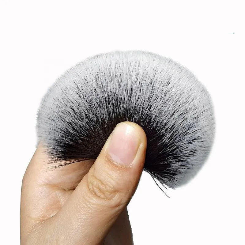 Black car detailing brush with ultra-soft pig hair bristles and a plastic handle.
