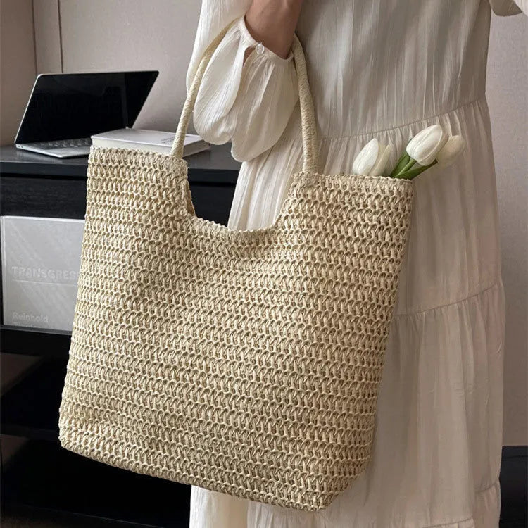 Women's large capacity straw bag in beige with canvas lining and double shoulder straps
