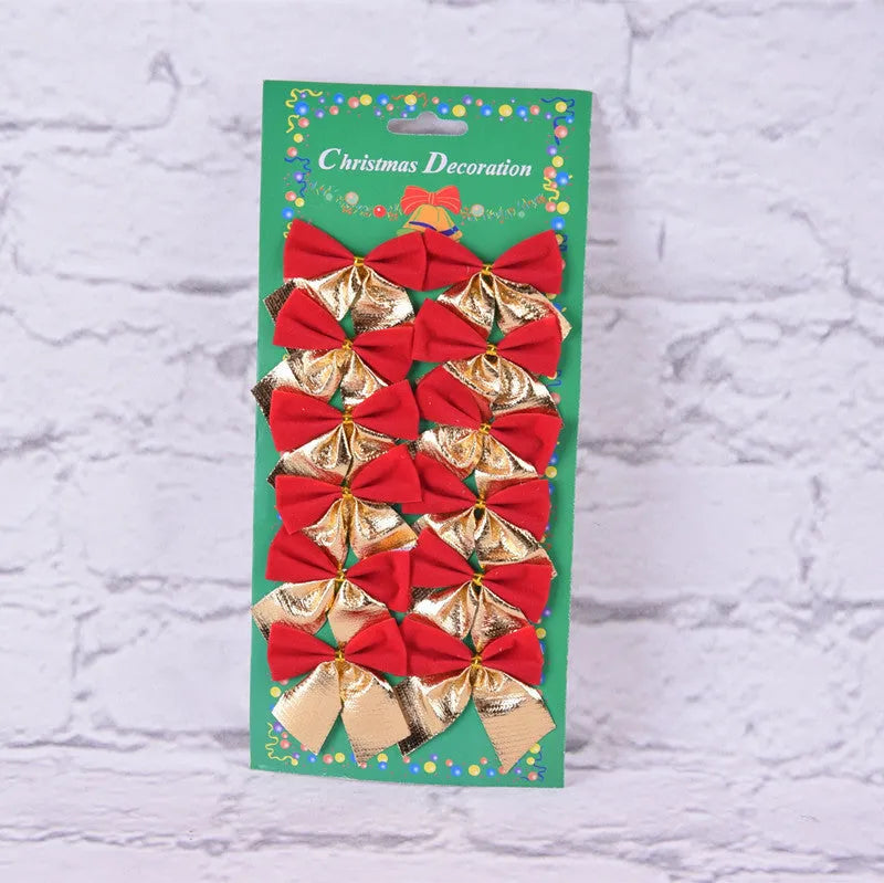 Red, gold, red gold, and silver 5 cm polyester Christmas tree bow ornaments on a green branch.