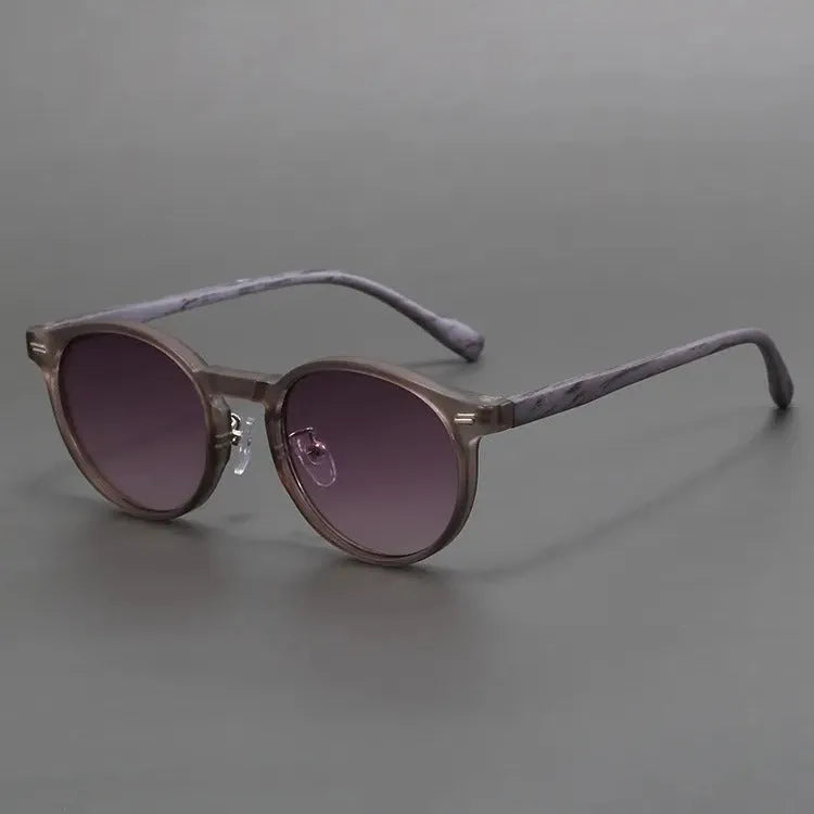 Retro round rim sunglasses with frosted frame and UV-protective lenses in multiple colour options.