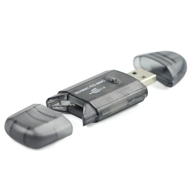 Transparent plastic USB card reader with optional LED light on a desk.