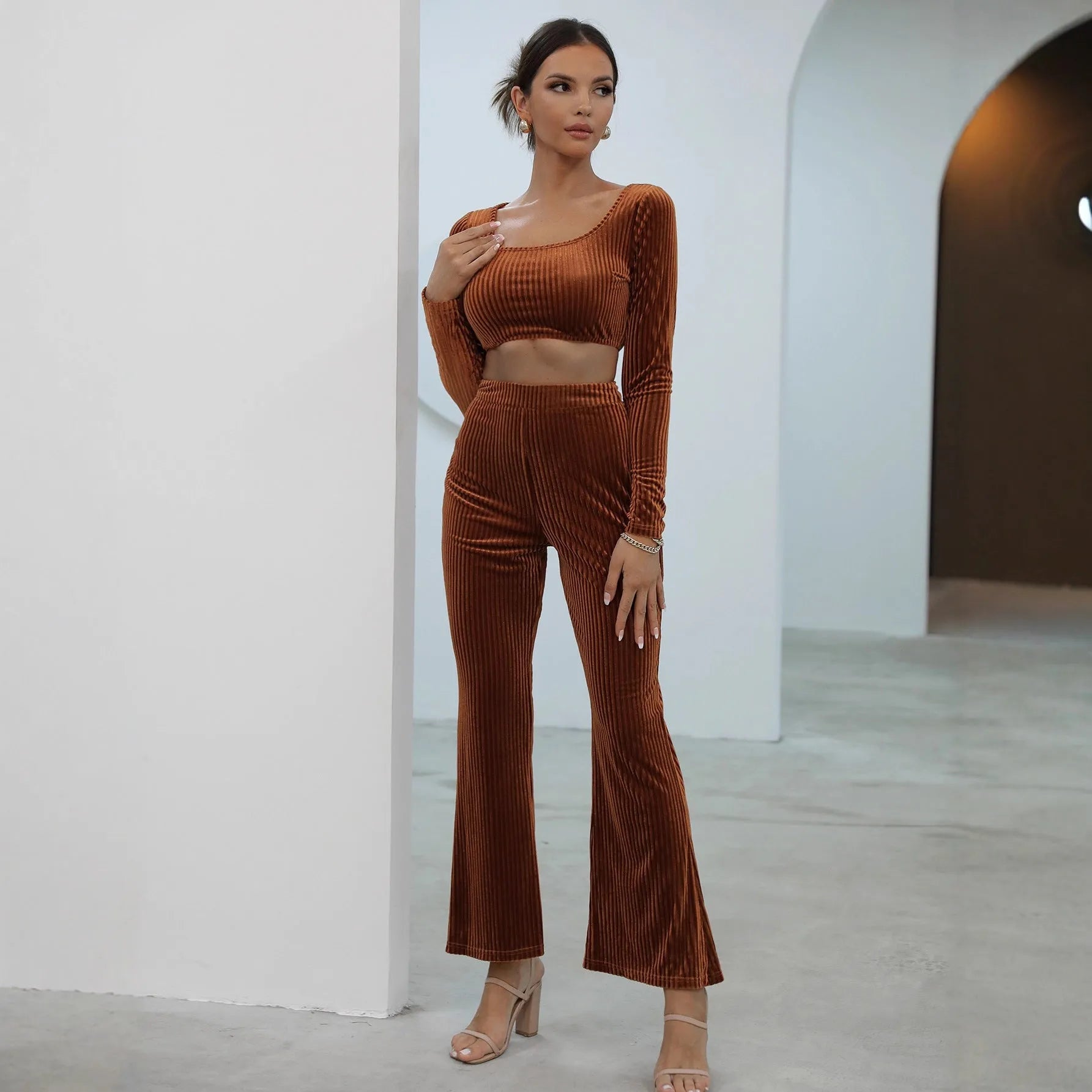 Caramel coloured long sleeve sweater and matching trousers casual set laid flat.