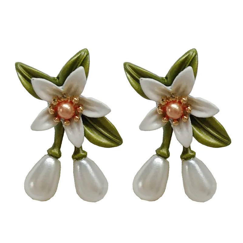 Flower-shaped women's earrings with sterling silver needle details and dual stud/clip wearing options