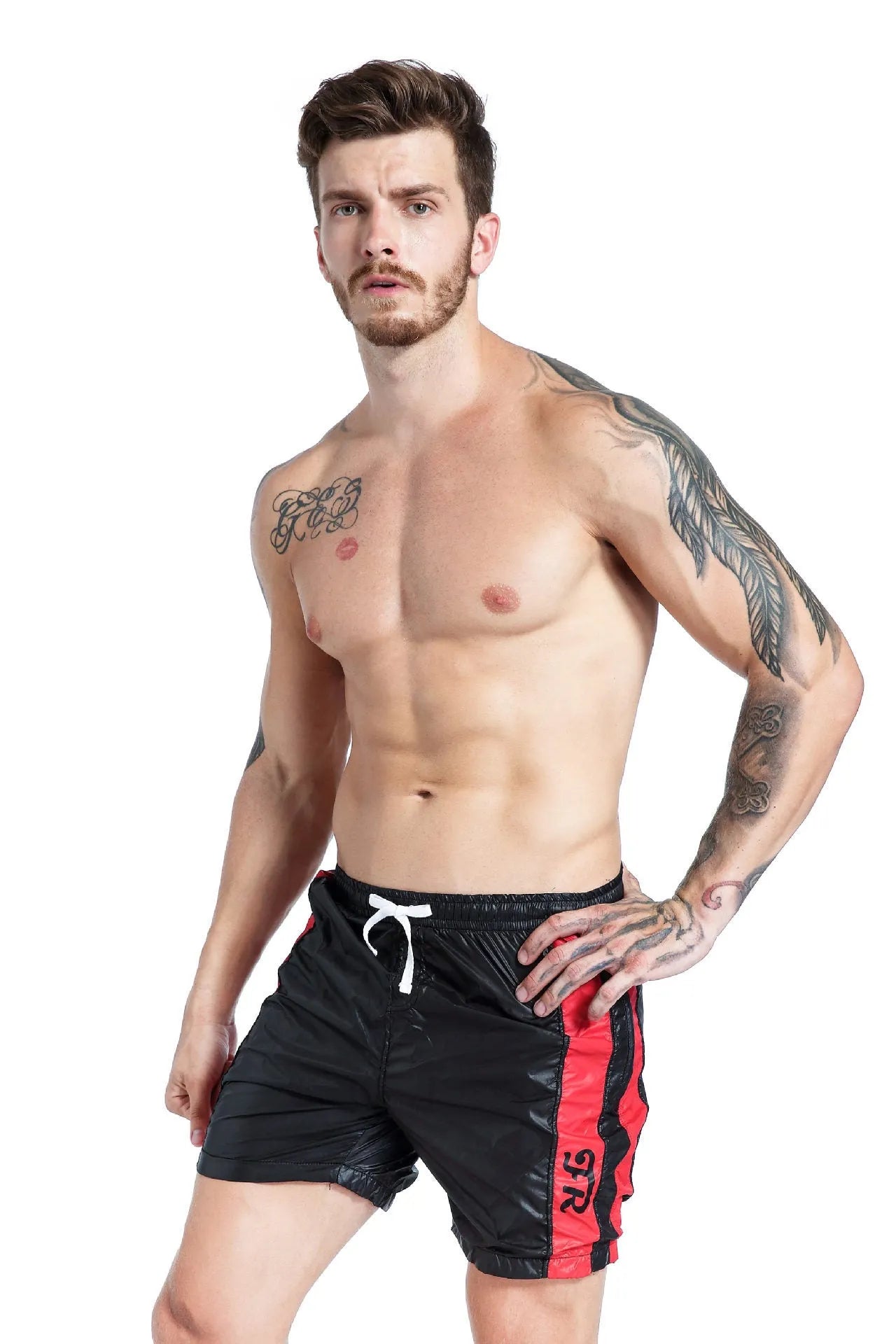 Blue men's slim-fit sports shorts with a lace-up front waistband on a plain background.