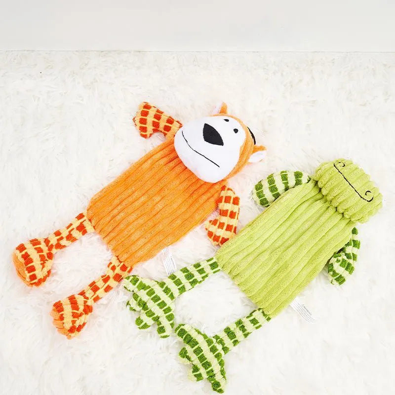 Orange and green plush dog toy with squeaker for aggressive chewers
