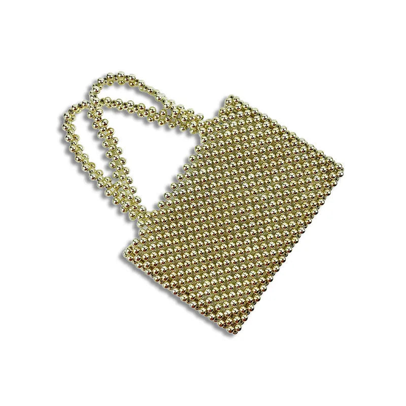 Gold hand-woven metal beads steamed crystal pearl bag, square vertical shape with double shoulder straps on a lady