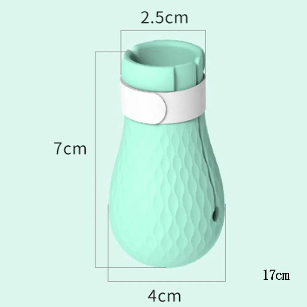 Four green silicone cat paw covers for anti-scratch protection during washing and medication