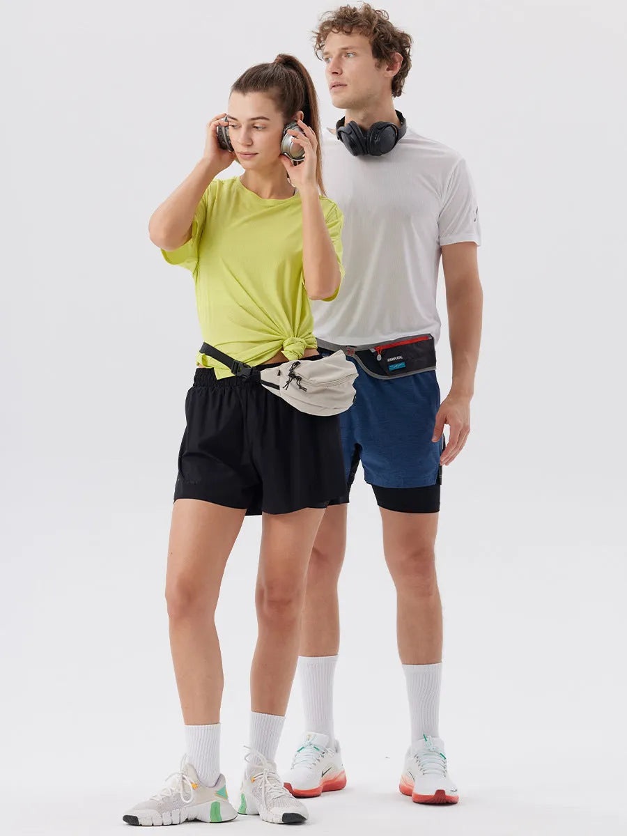 Man wearing black side-slit nylon sports shorts on a casual summer day.