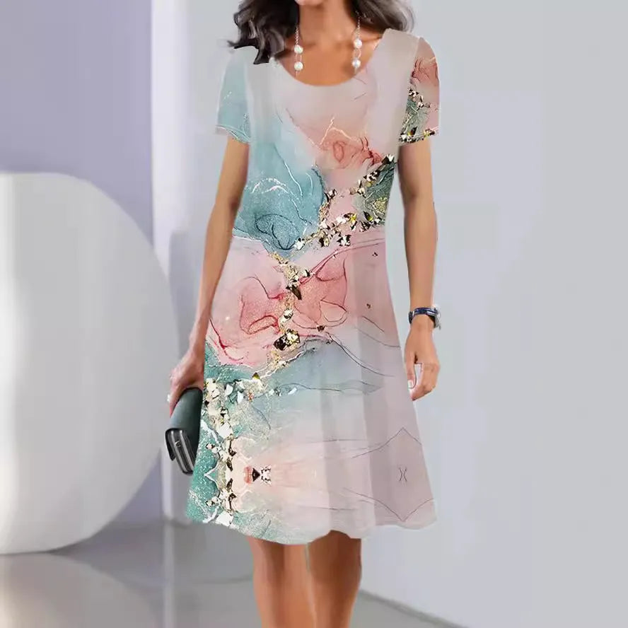 Light blue mid-length dress with white plants and flowers print, A-line skirt, and short sleeves.