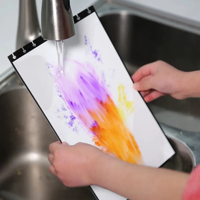 Children's A4 drawing book with PP cover, 15 pages, in orange colour, laid open on a desk