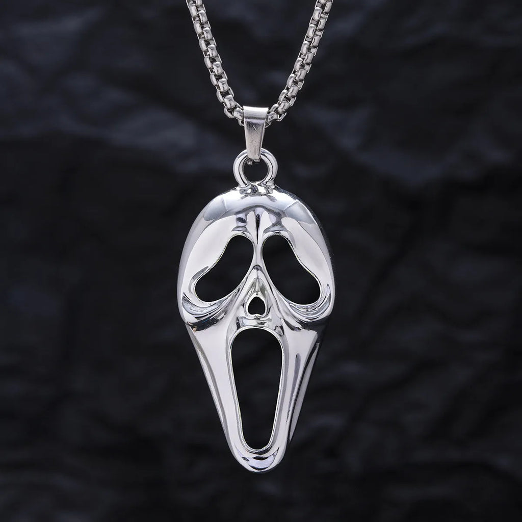 Exaggerated skull luminous mask pendant necklace on square pearl chain, available in luminous blue, luminous green, and hollow out colours
