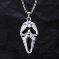 Exaggerated skull luminous mask pendant necklace on square pearl chain, available in luminous blue, luminous green, and hollow out colours