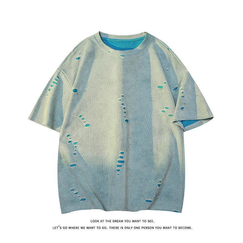 Man wearing a loose fit blue cotton blend T-shirt with ripped detail on the sleeve.