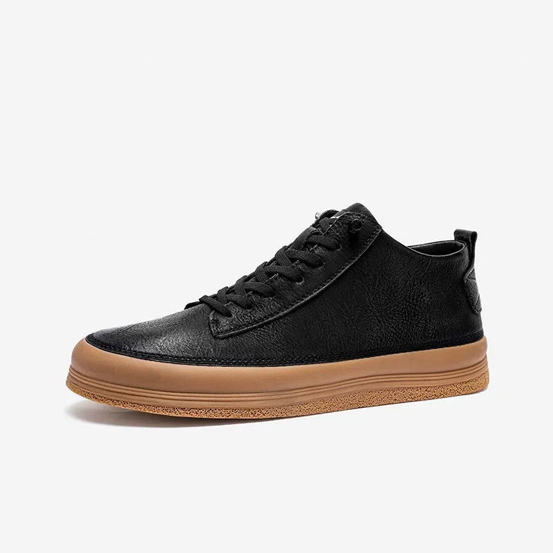 Men's black leather casual shoes with round toe and white flat rubber sole on a plain background