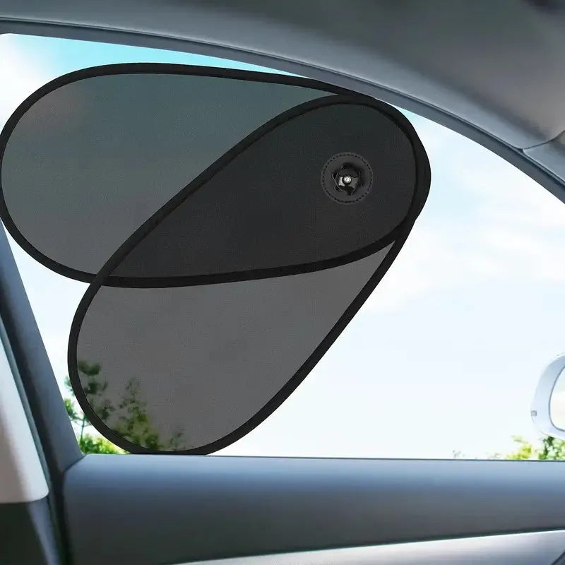 Black stretchy car side window sunshade for baby with suction cups attached to glass.
