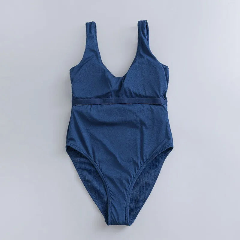 Navy blue women's one-piece sleeveless swimsuit with triangle neckline and slim-fit design.