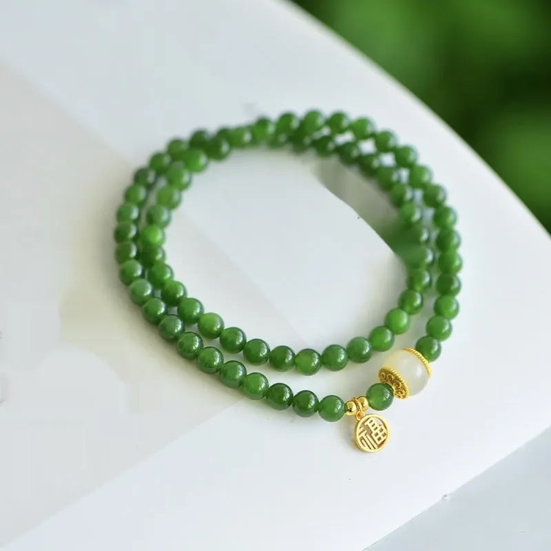 Double circle Hetian jade bracelet with geometric design and fu character elements