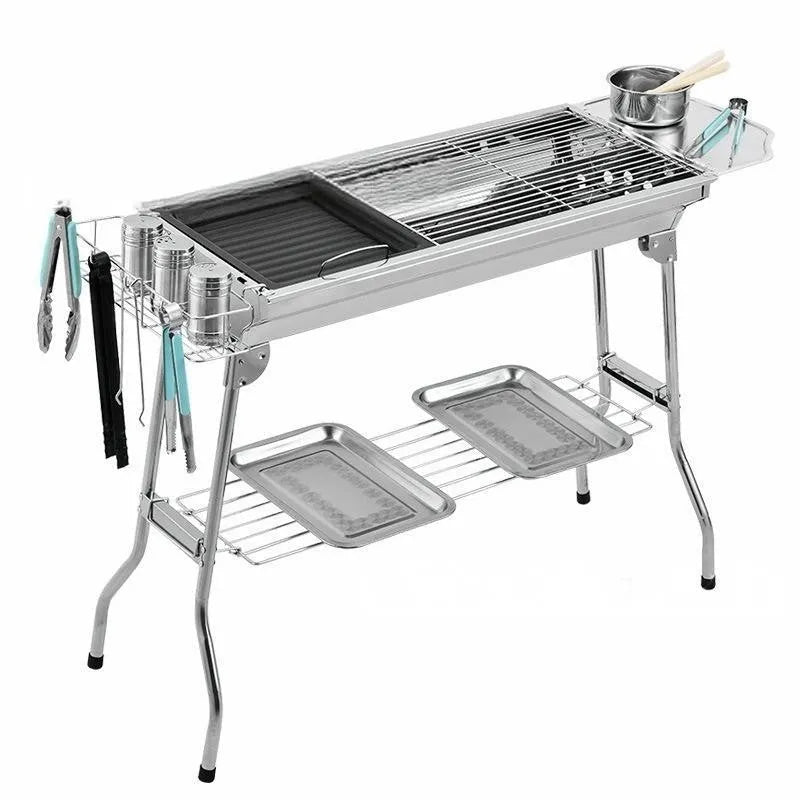 Large stainless steel portable folding barbecue oven with grill, shown unfolded for use.