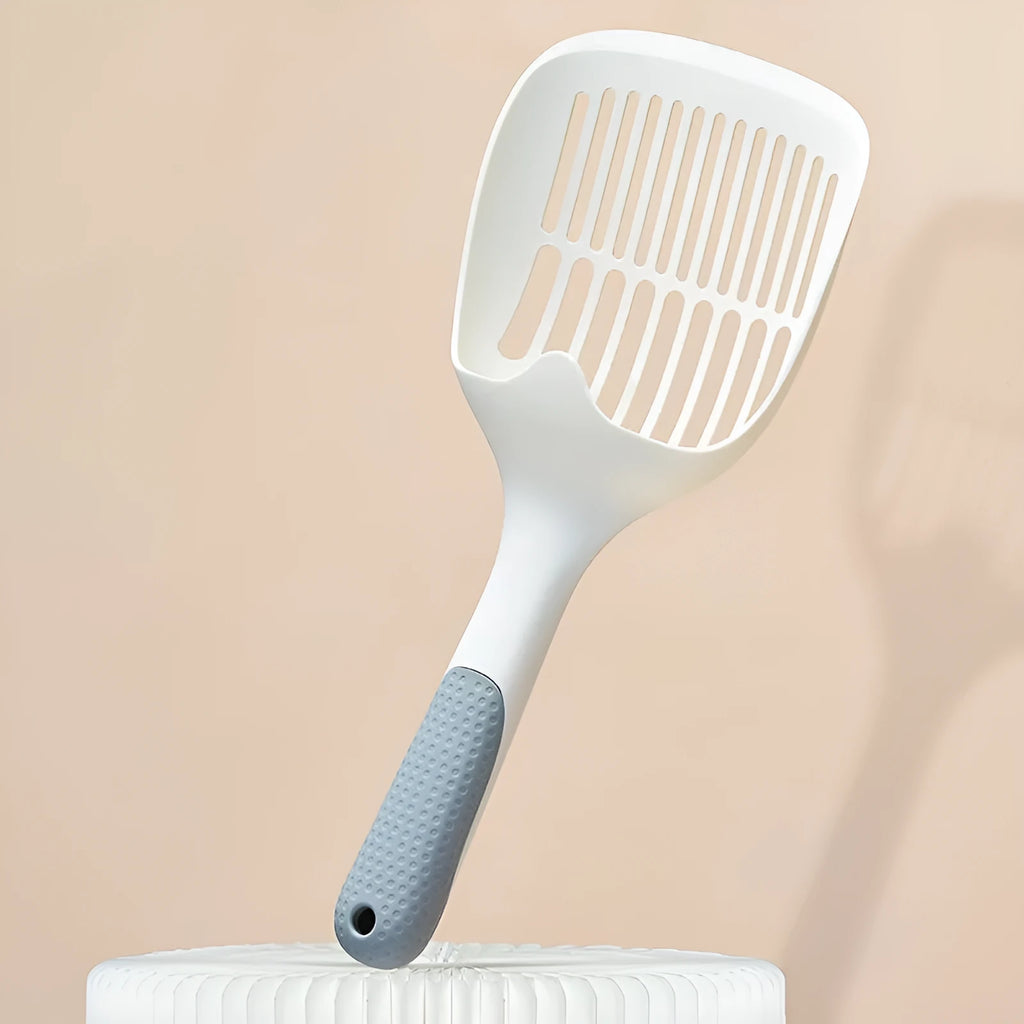 White plastic cat litter scoop with a self-cleaning base on a white background.