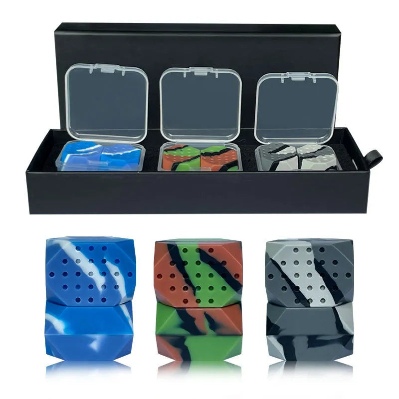 Two silicone camouflage-style facial muscle fitness balls for jaw training in transparent boxes.