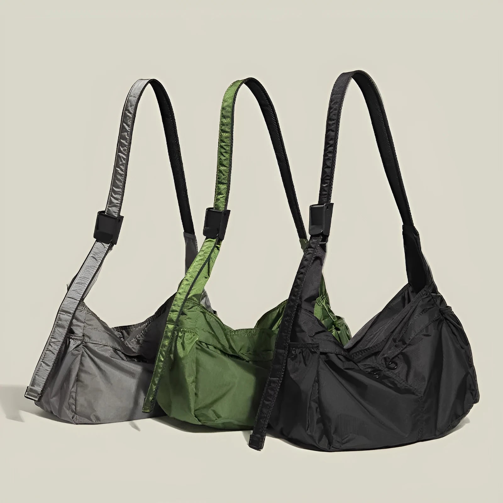 Casual black waterproof nylon messenger bag with single shoulder strap showing interior phone compartment