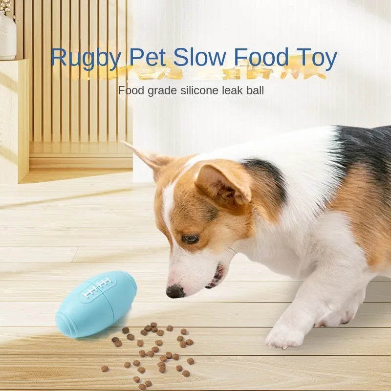 Blue silicone rugby ball dog chew toy with multiple small food leak holes on a white background.
