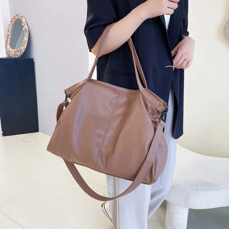 Large soft surface PU messenger bag with zipper opening and internal organisation pockets
