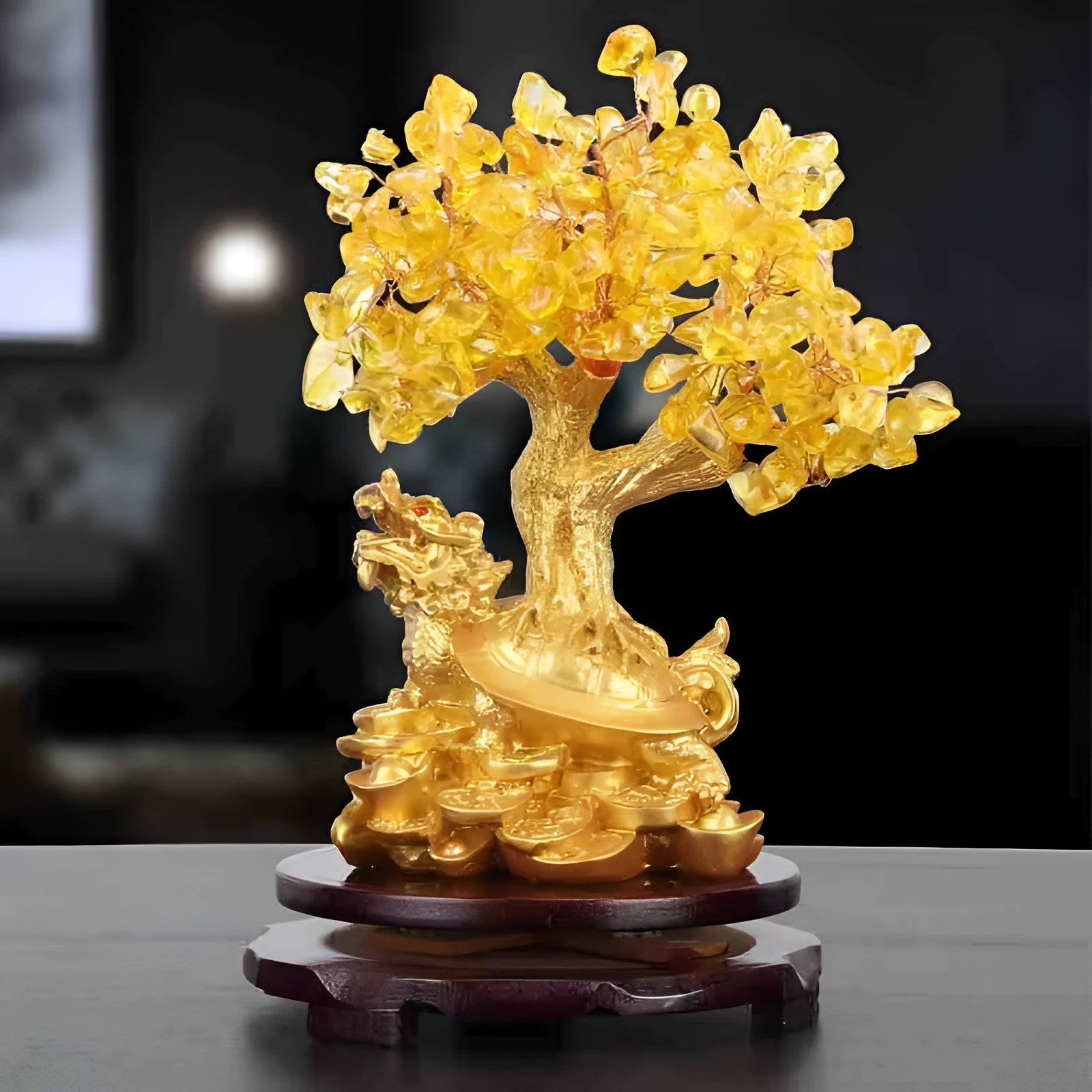 Citrine-coloured resin Feng Shui ornament of a small turtle on a money tree.
