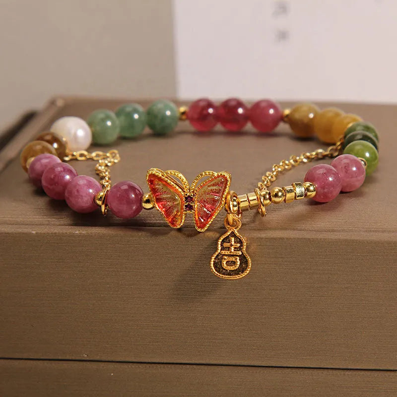 Women's tourmaline butterfly gourd bracelet with agate, showing jade coloured carved centrepiece.