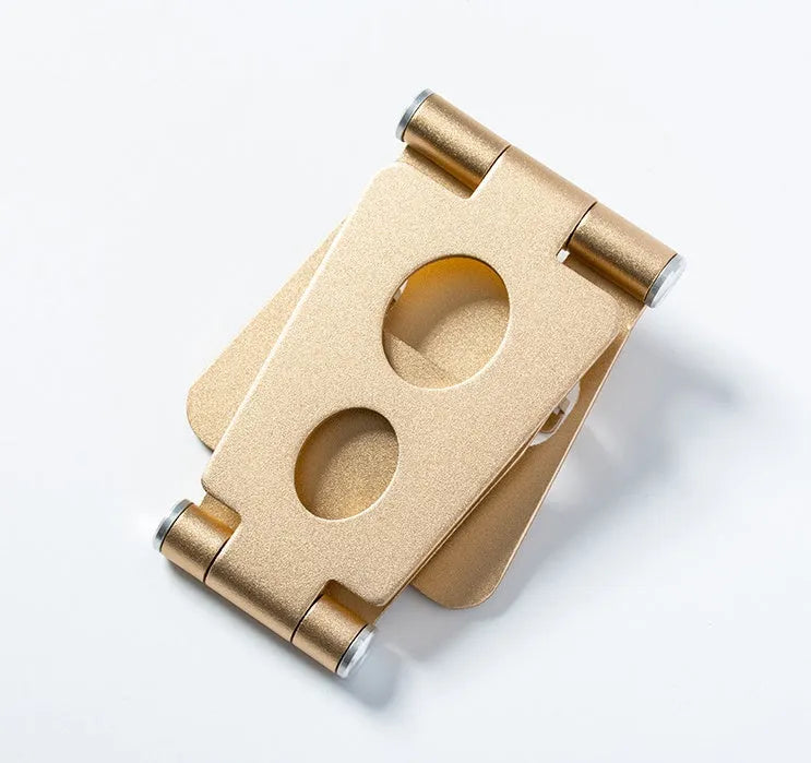 Folding mini mobile phone bracket in black, silver, rose, rose gold or champagne gold, for bed and desktop use.