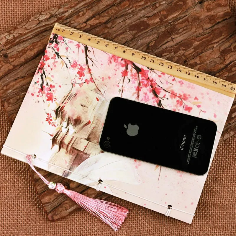 Chinese watercolour style thread-bound notebook in Azalea colour showing traditional binding and open pages