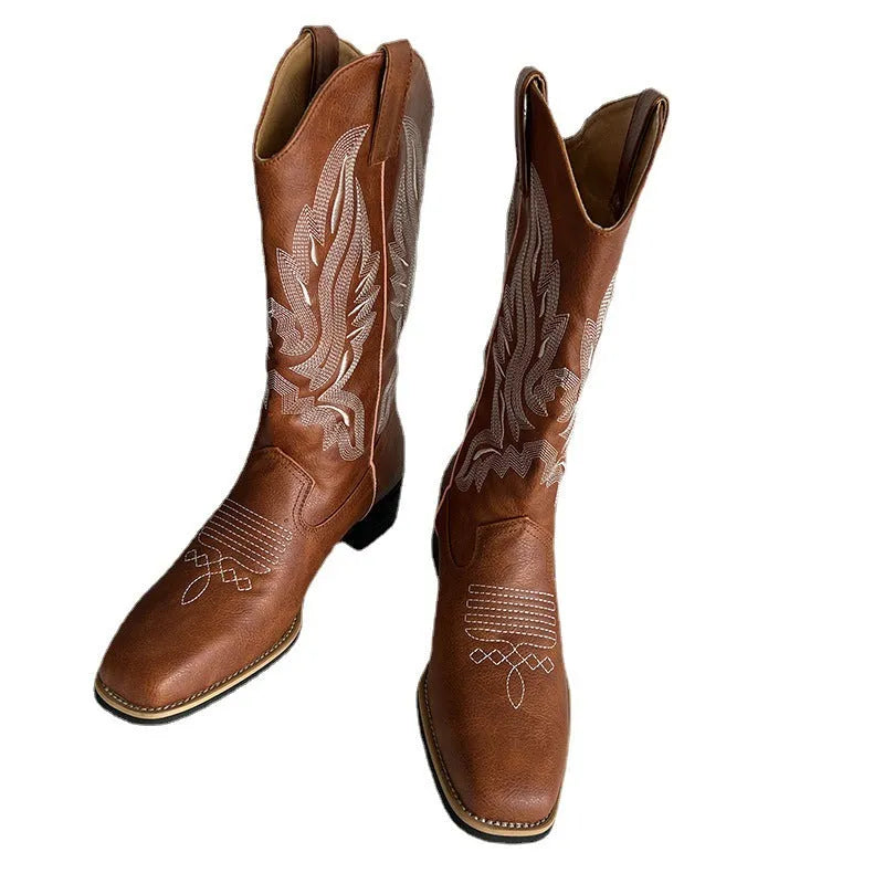 Brown women's mid-calf embroidered Martin boots with a leather lining and a low square heel.