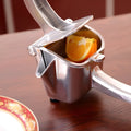Silver aluminium and steel lemon squeezer with large bowl for whole citrus fruit