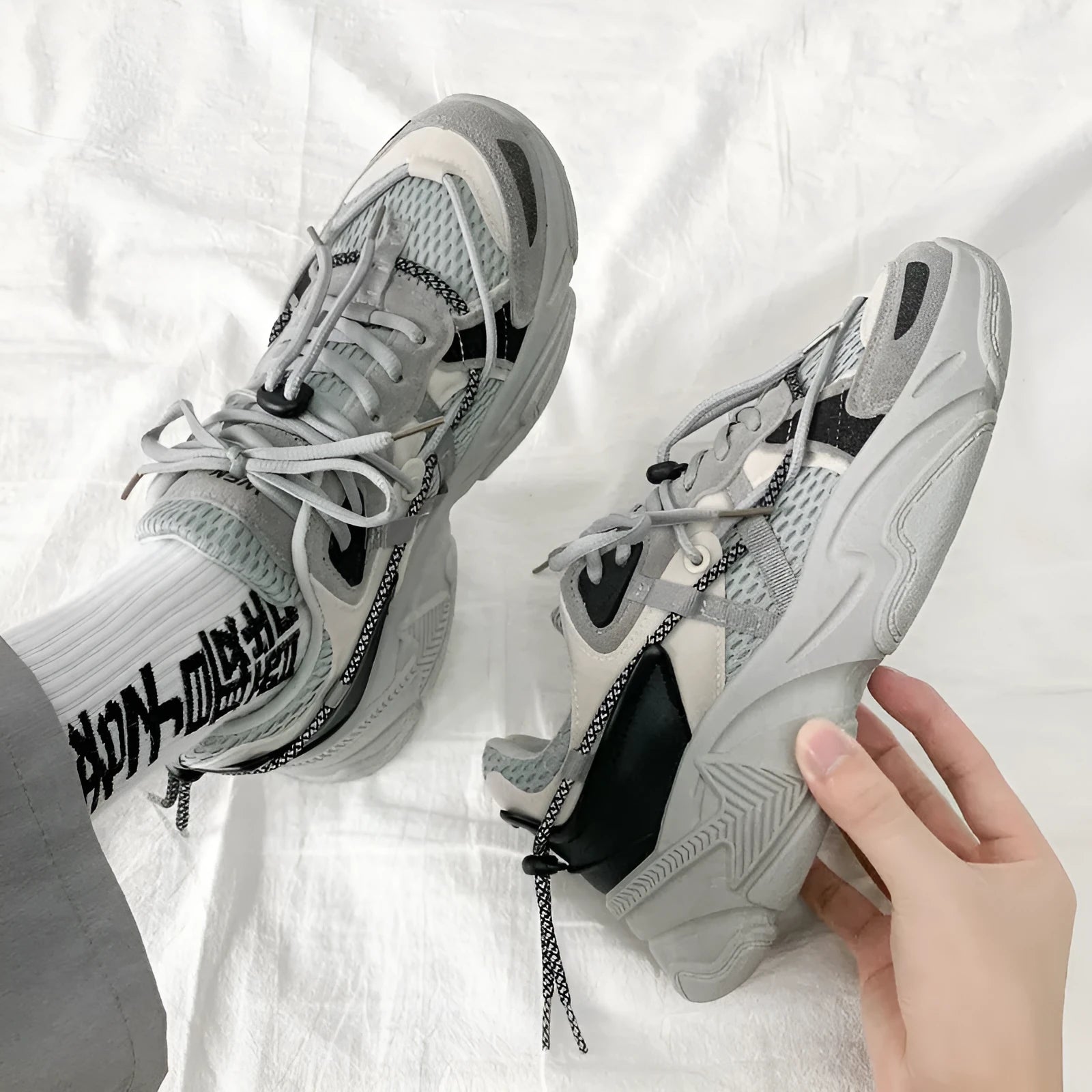 Men's white Korean-style platform dad shoes with lace-up front and thick sole.