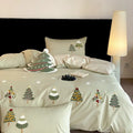 Pure cotton four-piece bedding set with embroidered Christmas tree towel decoration on duvet cover.