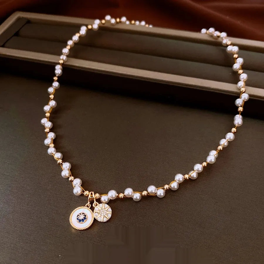 Gold electroplated necklace with round imitation pearl pendant and zircon accents on 41-50cm clavicle chain