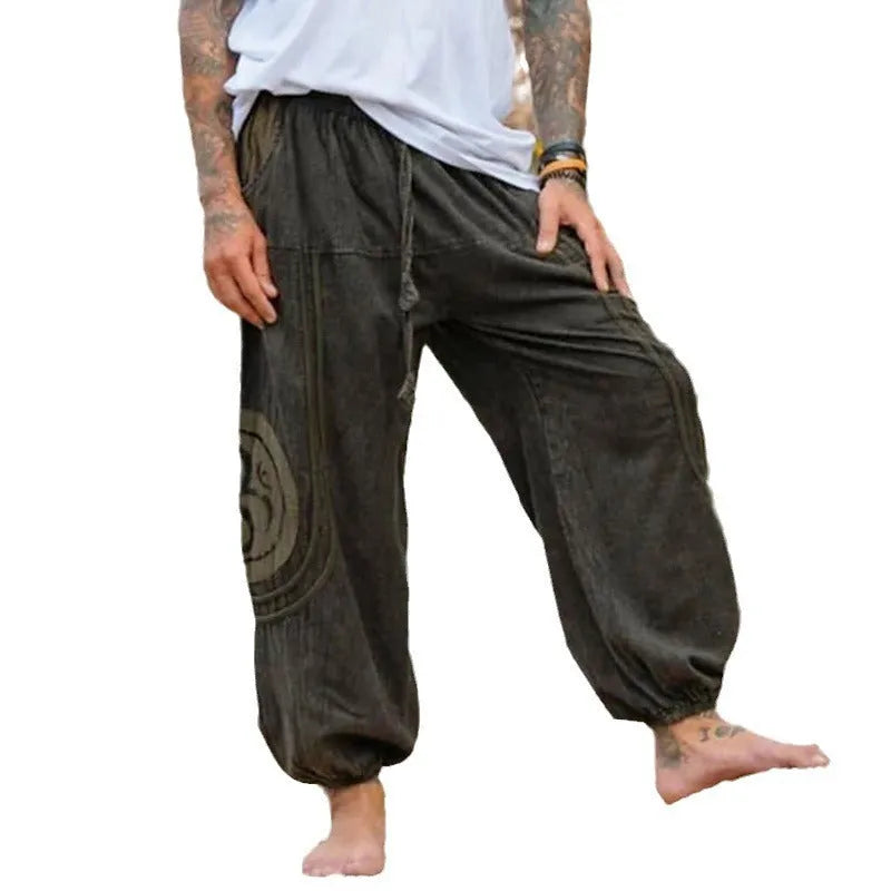 Men's dark green ethnic pattern trousers with ankle-tied design on mid waist