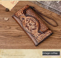 Retro brown Chinese floral embossed tri-fold women's leather wallet open to show compartments.
