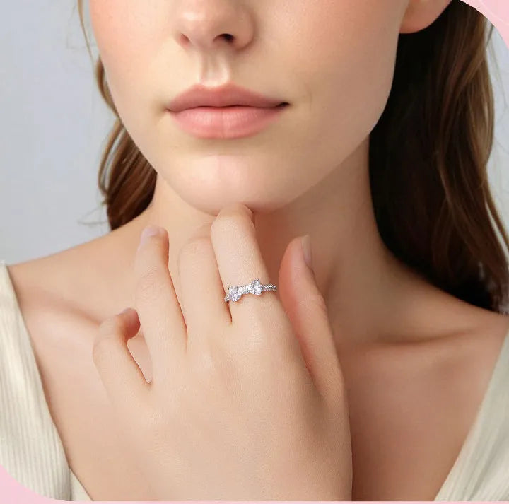 Sterling silver bow ring with zircon stone, available in sizes 6, 7, and 8, electroplated finish