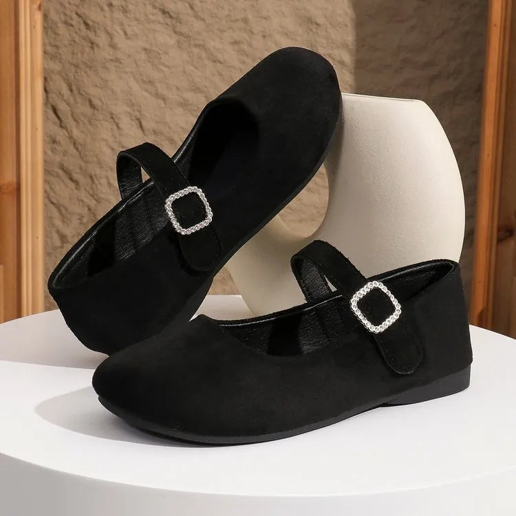 Black canvas fisherman shoes with rubber sole showing low-top design